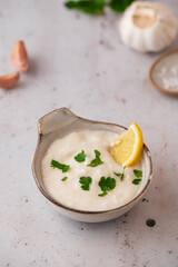 Lebanese Garlic sauce Toum or Salsat toum contains garlic, salt, olive oil and lemon juice....