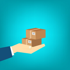 Delivery person hand holding two cardboard boxes, showcasing typical package delivery scenario.