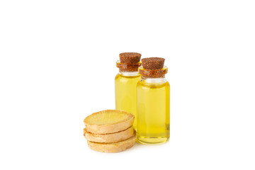 Ginger essential oil isolated on white background. Fresh ginger slices. Essence, serum, oil. Alternative medicine. Phytotherapy. Health and beauty concept.