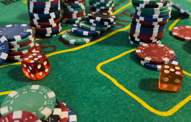 Poker Chips on a gaming table with dramatic lighting