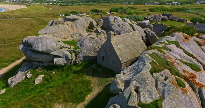 Aerial view of an ancient stone house in the rocks. A mountain village located in the commune of Kerlouan, the Meneham site is located in the heart of the Pagan region, Brittany