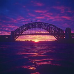Naklejka premium Vivid sunset over harbor bridge, birds flying, water reflection, travel postcard
