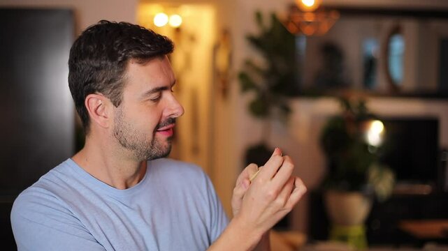 Man promoting safe sex with a cute way of showing the only manner to minize the risks