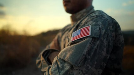 Us Army veteran honors Veterans Day. Man soldier adjusts the US military patch before duty. A US soldier with an American flag patch on his uniform prayers for Memorial Day. Independence Day.
- Powered by Adobe