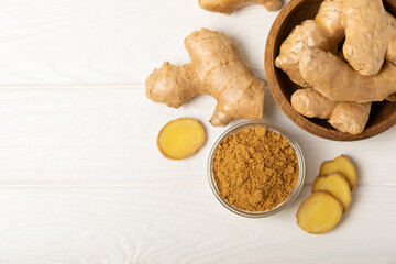 Fresh ginger on wooden background. Dry ginger. Sliced ​​ginger with honey and lemon. Ginger...