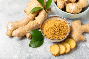 Fresh ginger on wooden background. Dry ginger. Sliced ​​ginger with honey and lemon. Ginger...