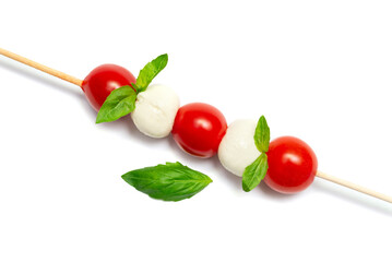 Caprese skewer with tomatoes on a white background