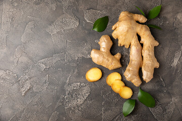 Fresh ginger on wooden background. Dry ginger. Sliced ​​ginger with honey and lemon. Ginger...