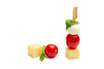 cheese and cherry tomato on a wooden stick on a white background