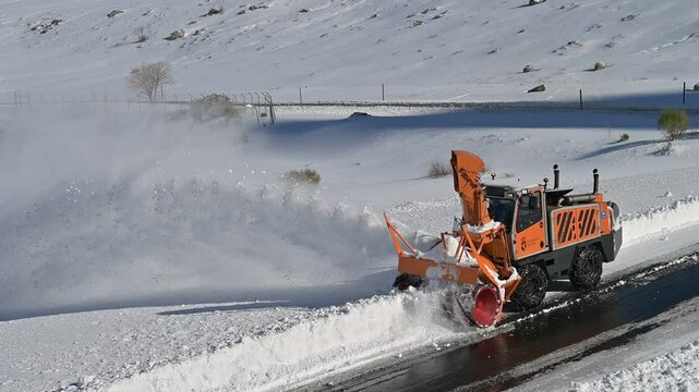 Snow Plow Clearing Heavy Snow. Winter Road Maintenance