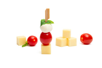 Caprese skewer with cherry tomatoes and cheese cubes on a white background