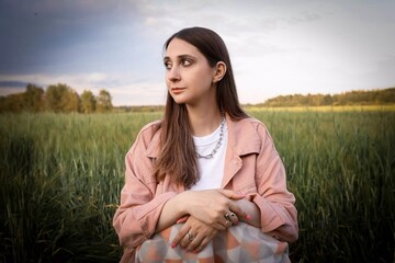 Beautiful girl in the field.  Spring/Summer photo. Summer style, shades of clothes match the color...