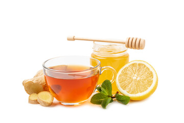 Cup of hot ginger tea with slices of ginger root isolated on white background. Warming drink. Alternative medicine. Tea with honey, lemon, ginger and mint. Space for text. Copy space