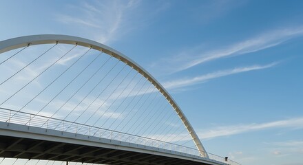 Modern arch bridge against blue sky - architectural achievement - travel and design material