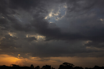 Beautiful sunset in the evening sky with clouds. Nature background.