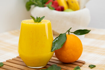 Orange juice in a glass cup. Healthy tropical fruit rich in vitamin C. Nutritious juice