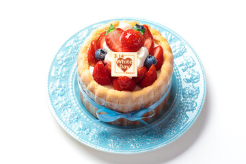 水色のリボンを飾られたホワイトデーケーキ
