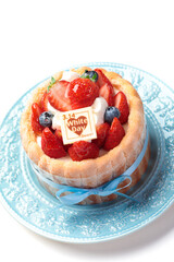 水色のリボンを飾られたホワイトデーケーキ