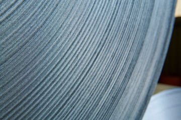 Galvanized steel coil detail and factory background.