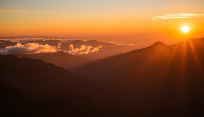 Obraz premium Breathtaking Sunrise Views Over Mountain Ranges and Cloud Inversions