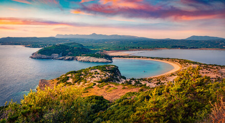 Impressive summer scene of Voidokilia Beach. Spectacular morning seascpae of Ionian sea, Pilos town location, Peloponnese peninsula, Greece, Europe. Vacation concept background.