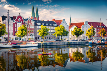 Adorable summer cityscape of Lubeck town, distinguished by Brick Gothic architecture, Germany. Calm...