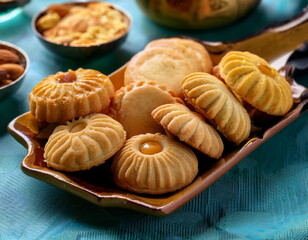 Close-up of traditional Eid cookies and pastries, intricately designed and ready to serve