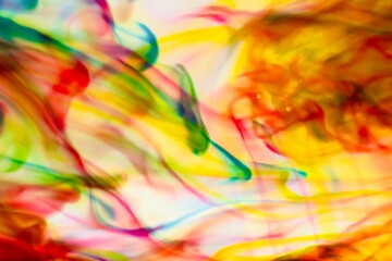 Abstract video with vibrant colors flowing with colored inks dispersed in water. The composition...