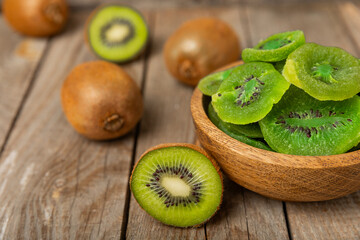 Kiwi dried fruit on wooden background. kiwi candied fruit. Healthy food. Ingredient for baking...