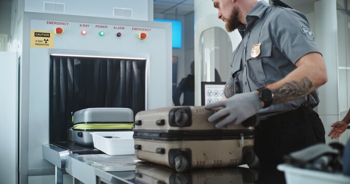 Airport Security Checkpoint: TSA Worker Putting Luggage and Personal Items in Trays on Conveyor Belt with X-ray Metal Detector. Diverse People Walking Through Human Body Scanner. Screening Procedures.