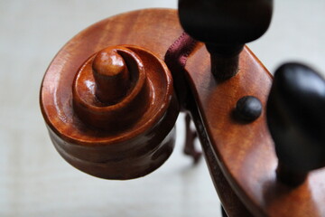 The vintage retro orange violin, top spiral of the musical instrument close up picture, wallpaper...