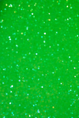 A light green bokeh-style background with defocused light creates an elegant space for text or design elements.