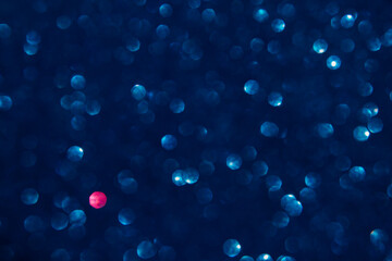 A blue bokeh-style background with defocused light creates an elegant space for text or design elements.