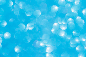 A blue bokeh-style background with defocused light creates an elegant space for text or design elements.