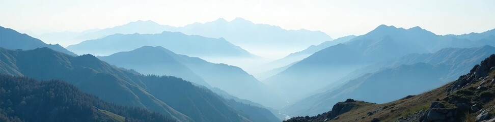 Obraz premium Foggy mountain landscape with misty peaks and valleys, rugged landscape, mountain terrain, wilderness area