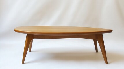 A Scandinavian-style coffee table with a natural oak finish and tapered legs, perfectly displayed on a clean white backdrop.