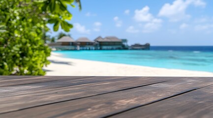 Fototapeta premium Serene tropical beach scene featuring a rustic wooden table against a blurred seaside view