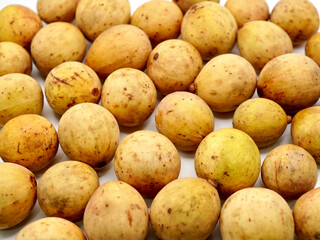 Full frame image of duku fruits (Lansium parasiticum) isolated on a clean white background