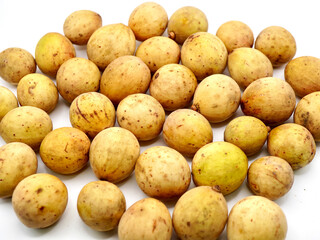 Close-up image of duku fruits or lansium parasiticum isolated on a clean white background
