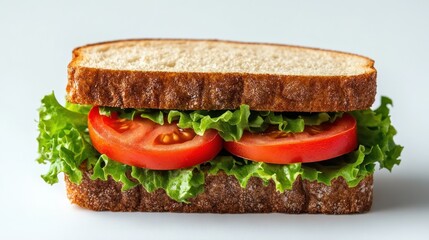 Simple tomato and lettuce sandwich on whole wheat bread.