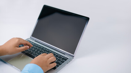 Mockup screen blank, Concept analysis, Growth development investment, Stock market, Strategy market plan, Stock fluctuation, Businessman fingers typing blank screen laptop computer in office.