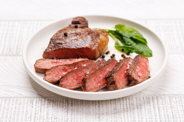 A perfectly cooked sliced striploin steak with a juicy, tender texture
