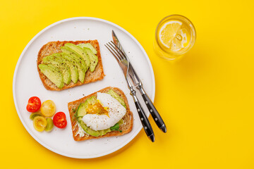 Delicious avocado toasts topped with perfectly cooked poached eggs