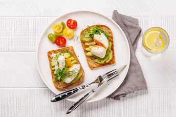 Delicious avocado toasts topped with perfectly cooked poached eggs