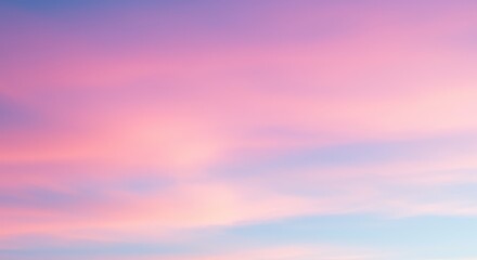 Fototapeta premium Serene pastel sky at sunset with soft clouds reflecting warm hues