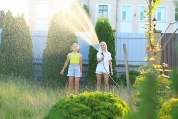 a mother and her daughter joyfully water their lush green lawn together. Their shared laughter and teamwork reflect the beautiful bond between them