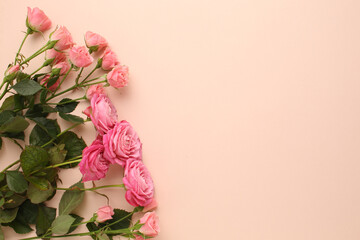 Assorted roses heads. Various soft roses and leaves scattered on a vintage background, overhead view