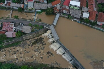 Aerial view of the Katulampa dam in Bogor, Indonesia during flood conditions