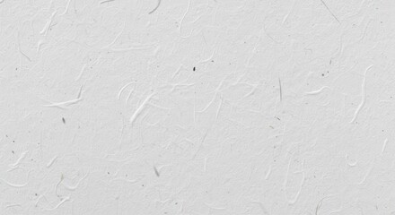 Close-up of textured white paper with natural fibers, ideal for backgrounds