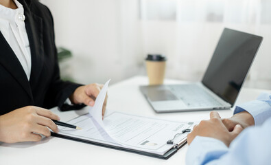Business people hold a resume and talk to job applicants for job interviews about careers and Their personal history in the company. Recruitment concepts